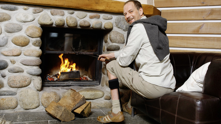 Jürgen sitting by the fireplace