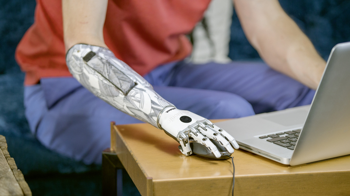 Stephen sitting at his laptop