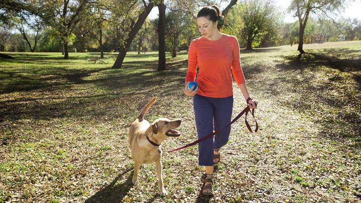 Cassie goes for a walk with her dog.