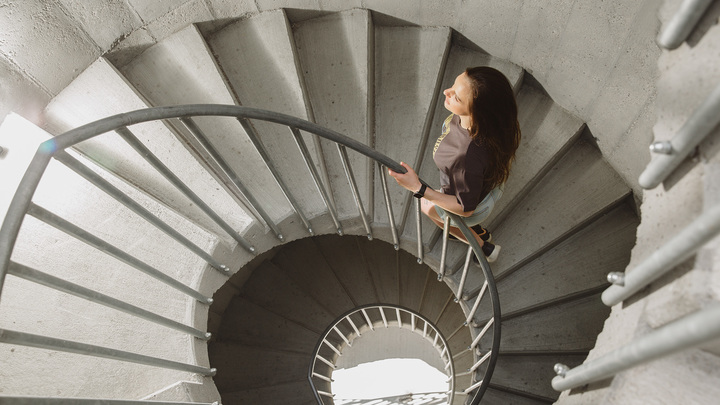 Daniella climbs the stairs to a lookout.