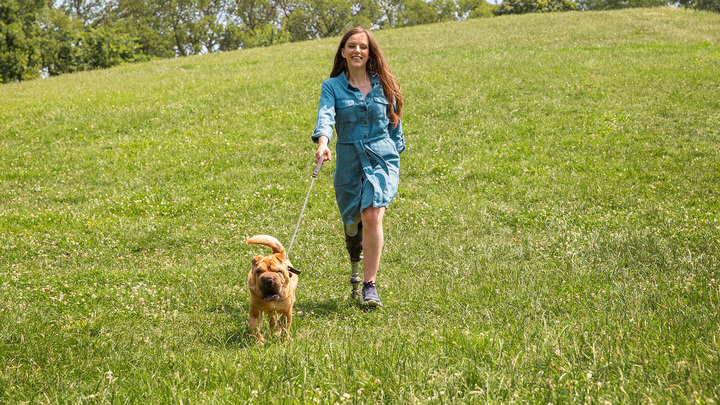 Daniella runs after her dog with ease.