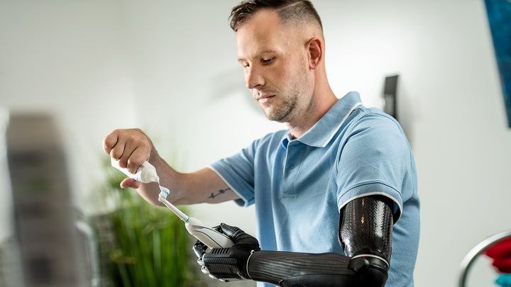 User holding a toothbrush in their hand