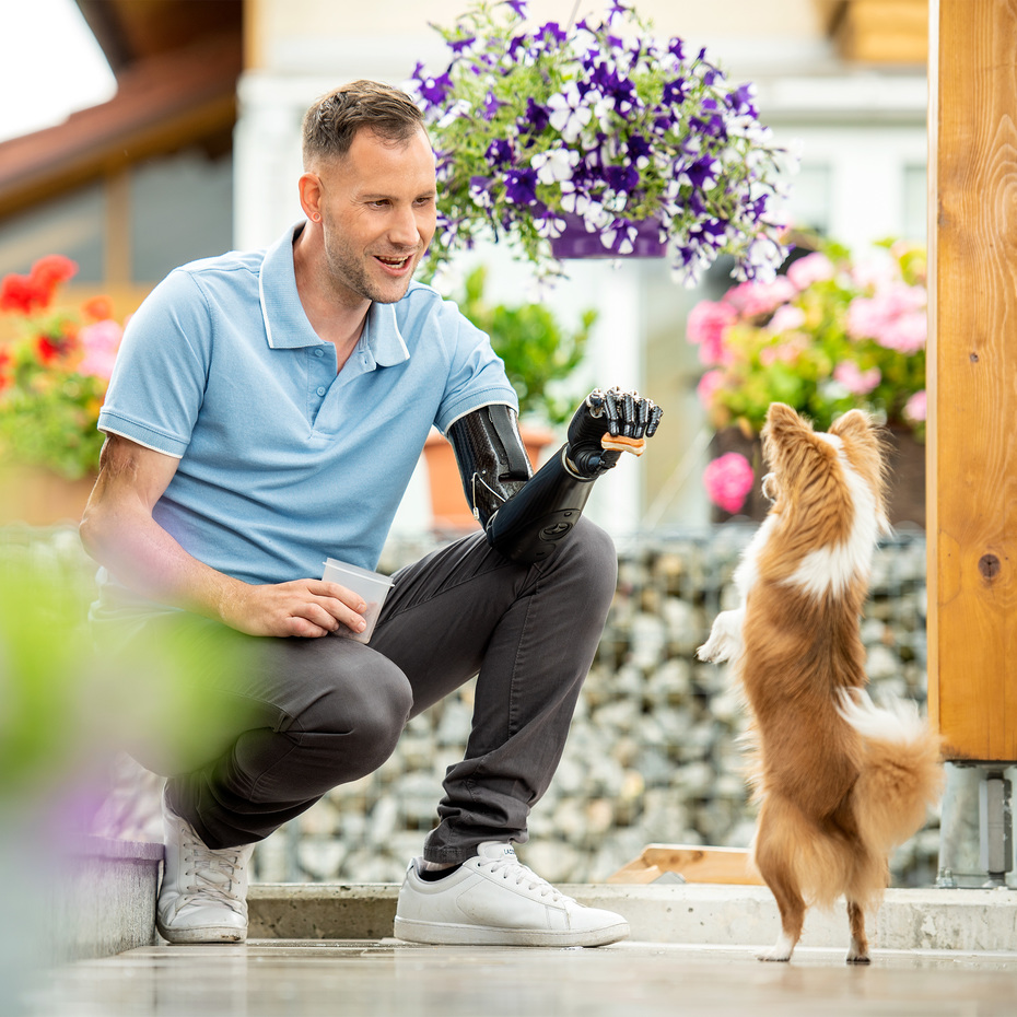 Stefan playing with his dog.