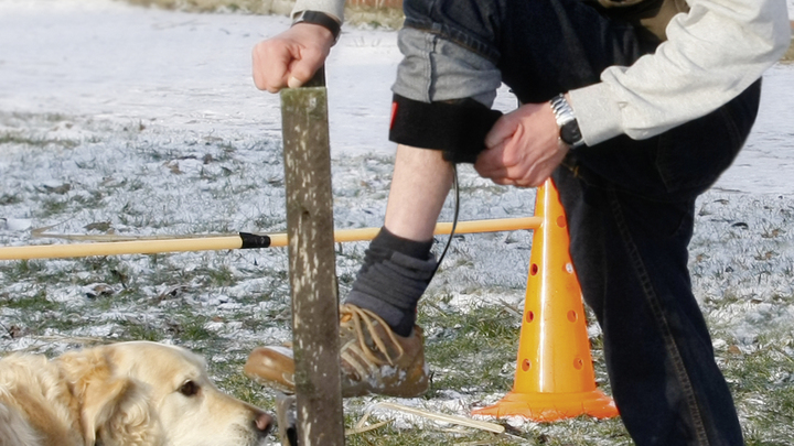 Man puts his leg up and closes the orthosis