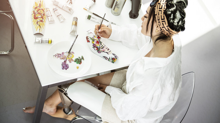 A C-Leg user is painting her shield insert