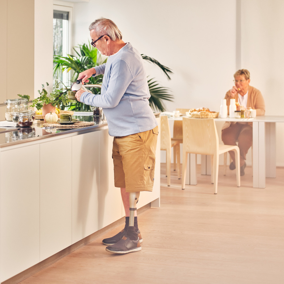 Kenevo user Robert is standing in his kitchen making coffee.